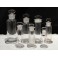 7 flacons à pharmacie en verre transparent début 20ème siècle